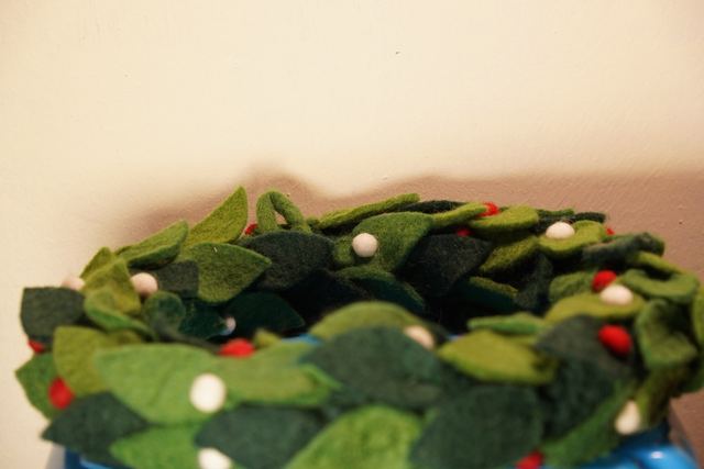 Leafy green felt wreath with red berries