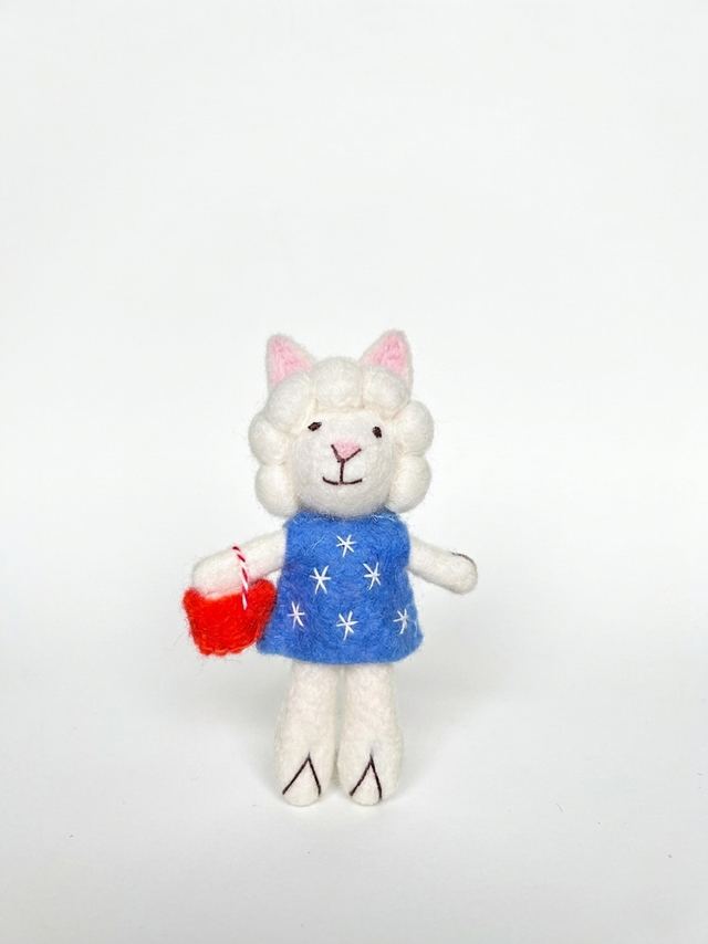 Small felt lamb in a blue dress