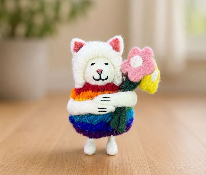 Felt cat holding a felt flower bouquet