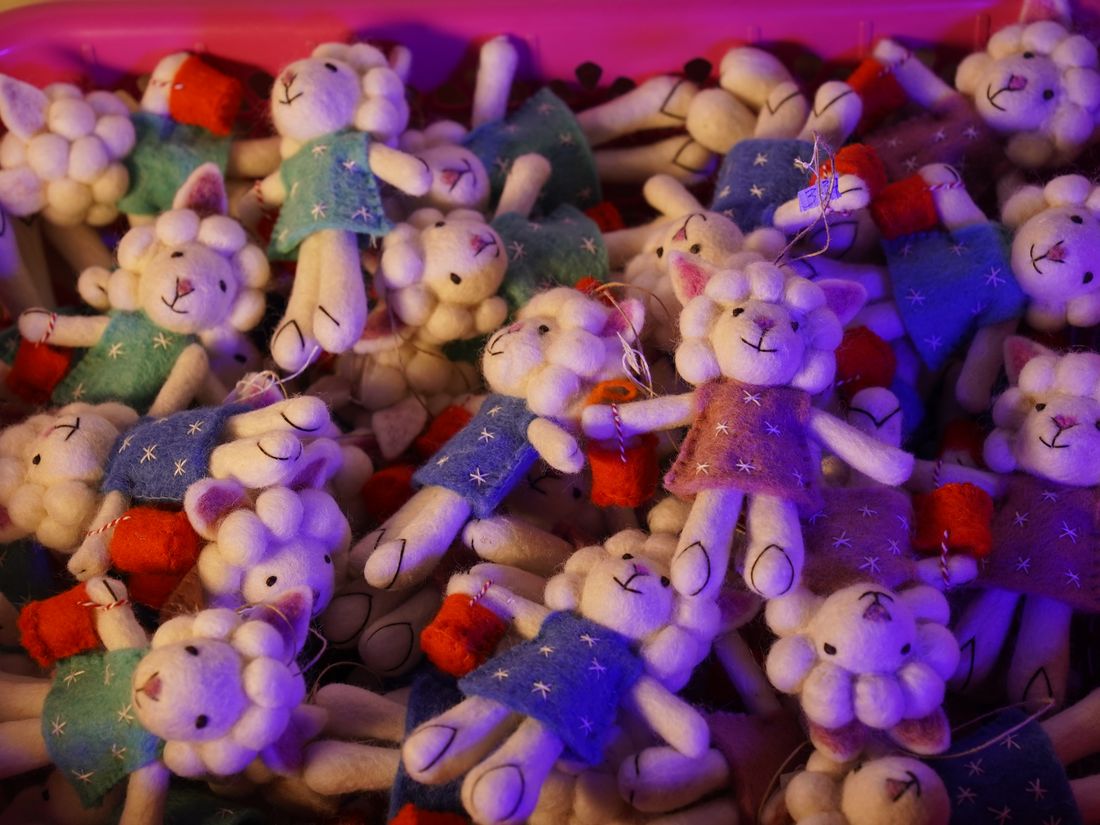 A heap of colorful handmade felt sheep toys