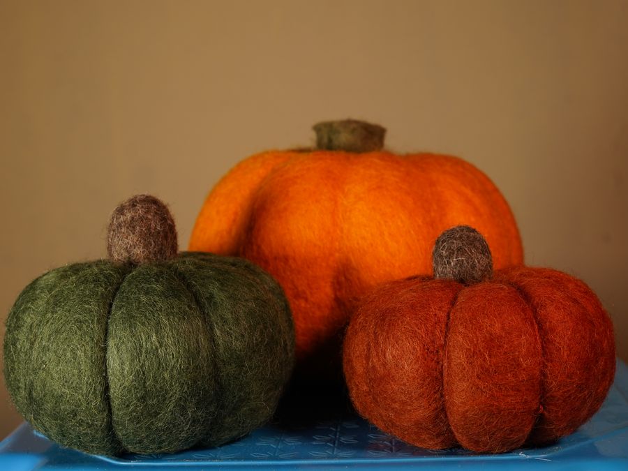 Handmade felt pumpkins in green and orange