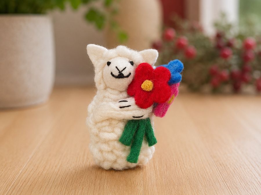 Felt lamb holding a red felt flower bouquet